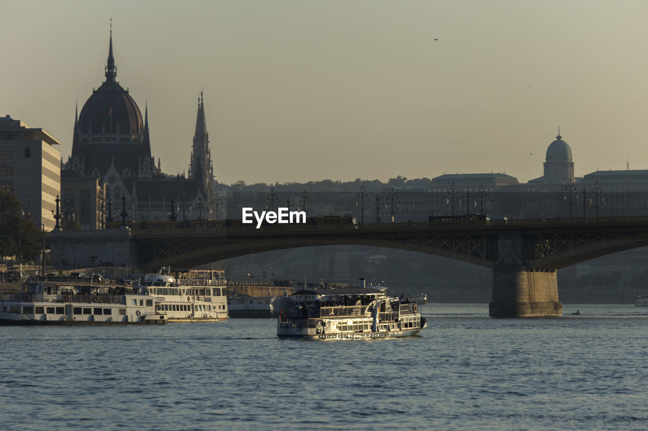 View of bridge over river in city