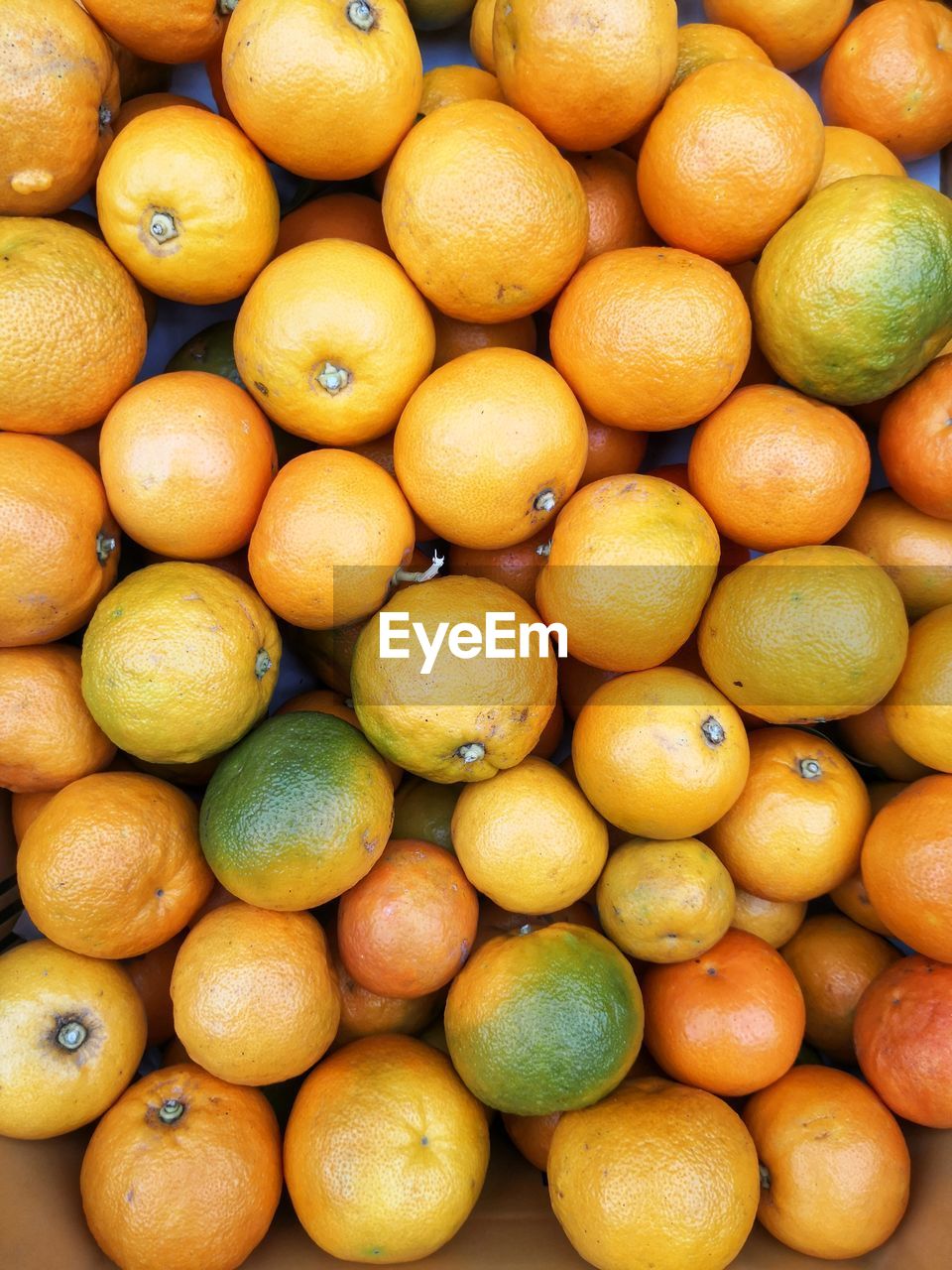 Full frame shot of oranges in market