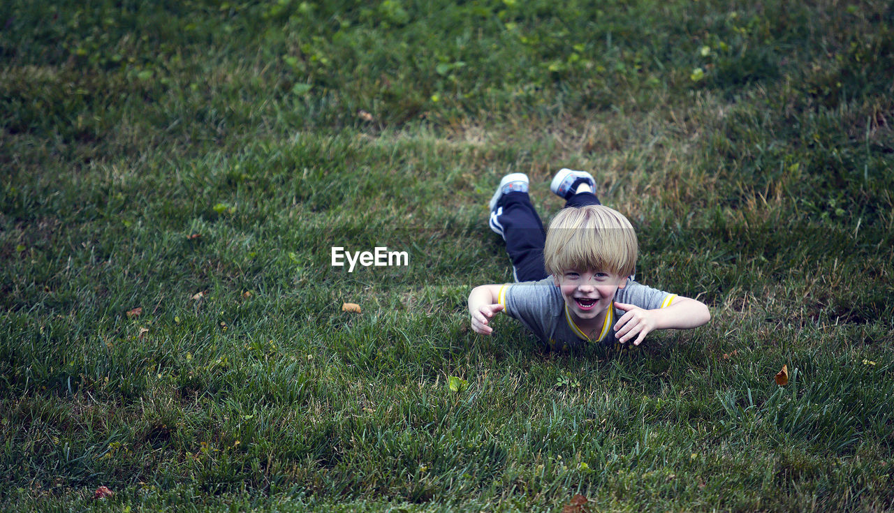 Boy playing on grass