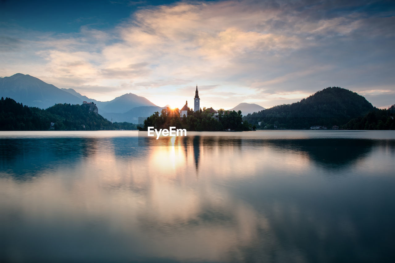 Reflection of clouds in lake at sunset