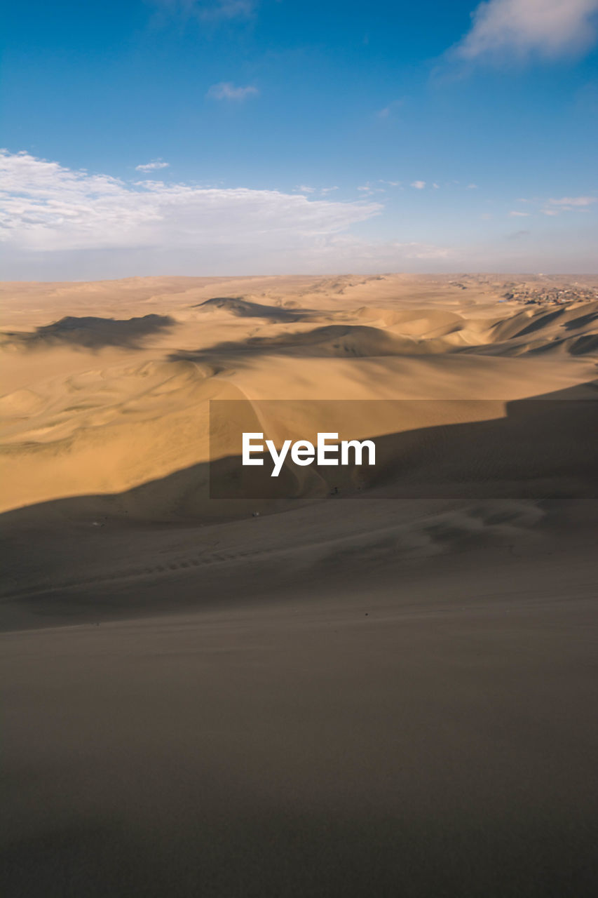 VIEW OF DESERT AGAINST SKY DURING SUNSET