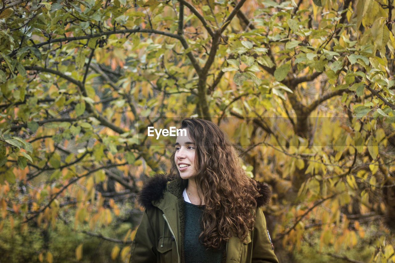 Smiling woman standing outdoors