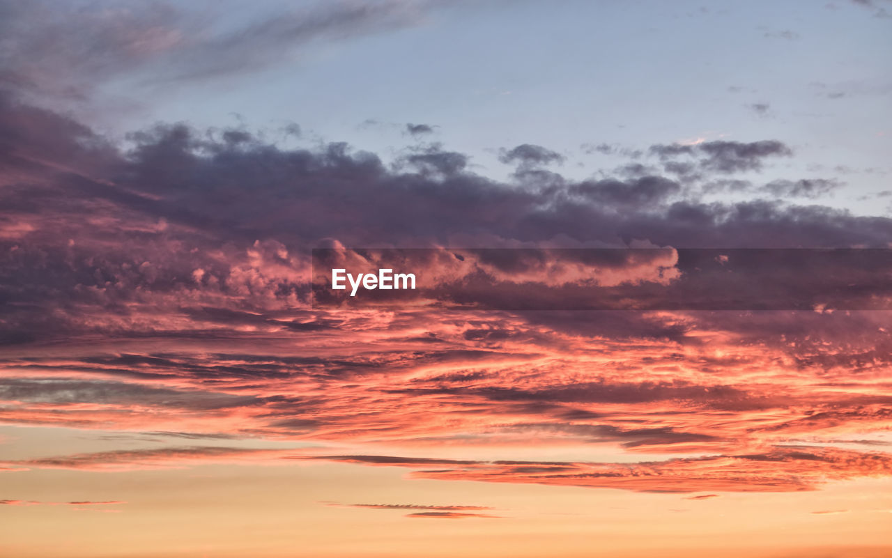 Scenic view of dramatic sky during sunset