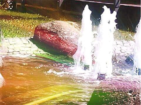 WATER FLOWING THROUGH ROCKS