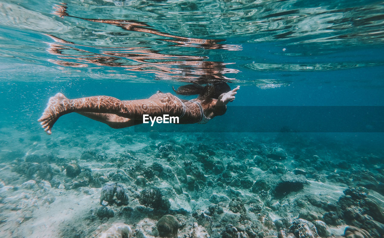 Woman swimming in sea