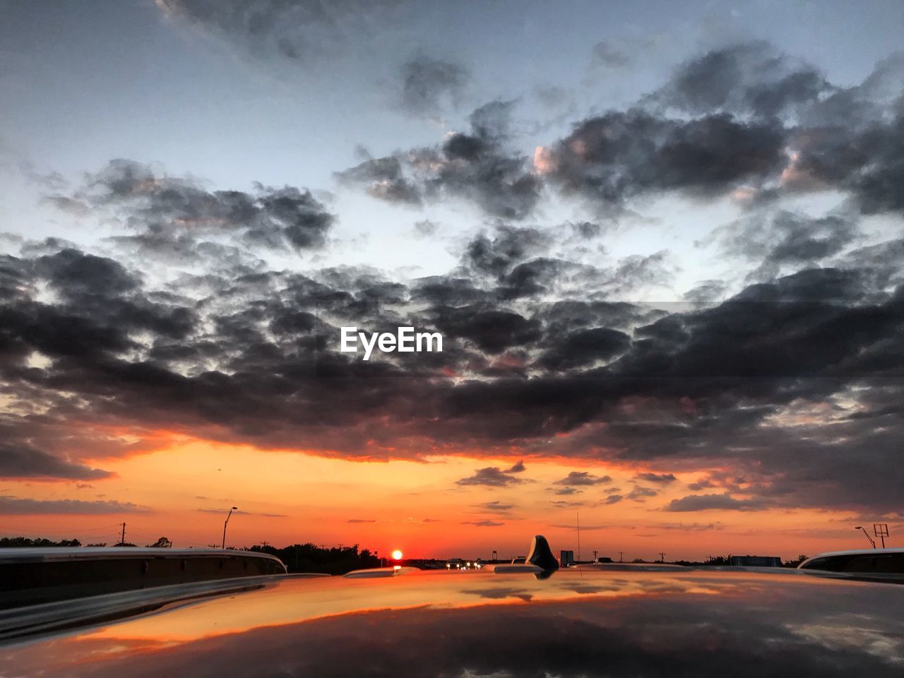 SCENIC VIEW OF DRAMATIC SKY DURING SUNSET SEEN THROUGH AIRPLANE