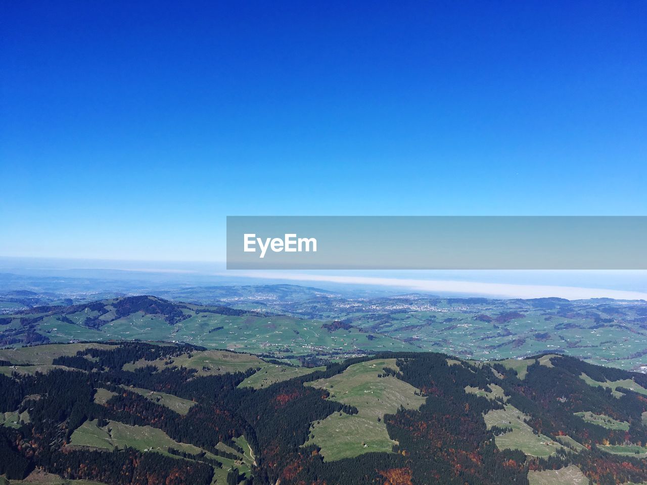 AERIAL VIEW OF LANDSCAPE AGAINST BLUE SKY