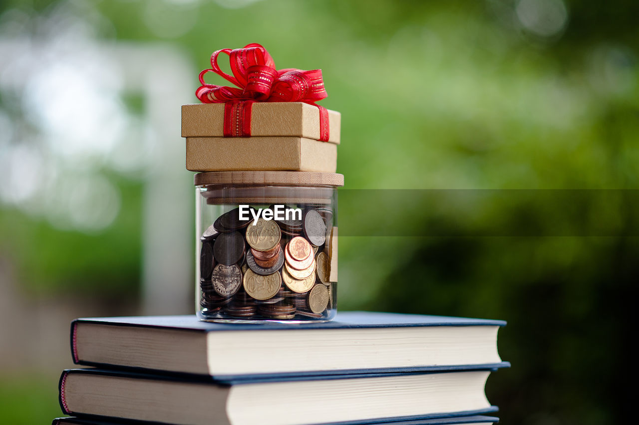 CLOSE-UP OF BOOKS ON TABLE IN BOX