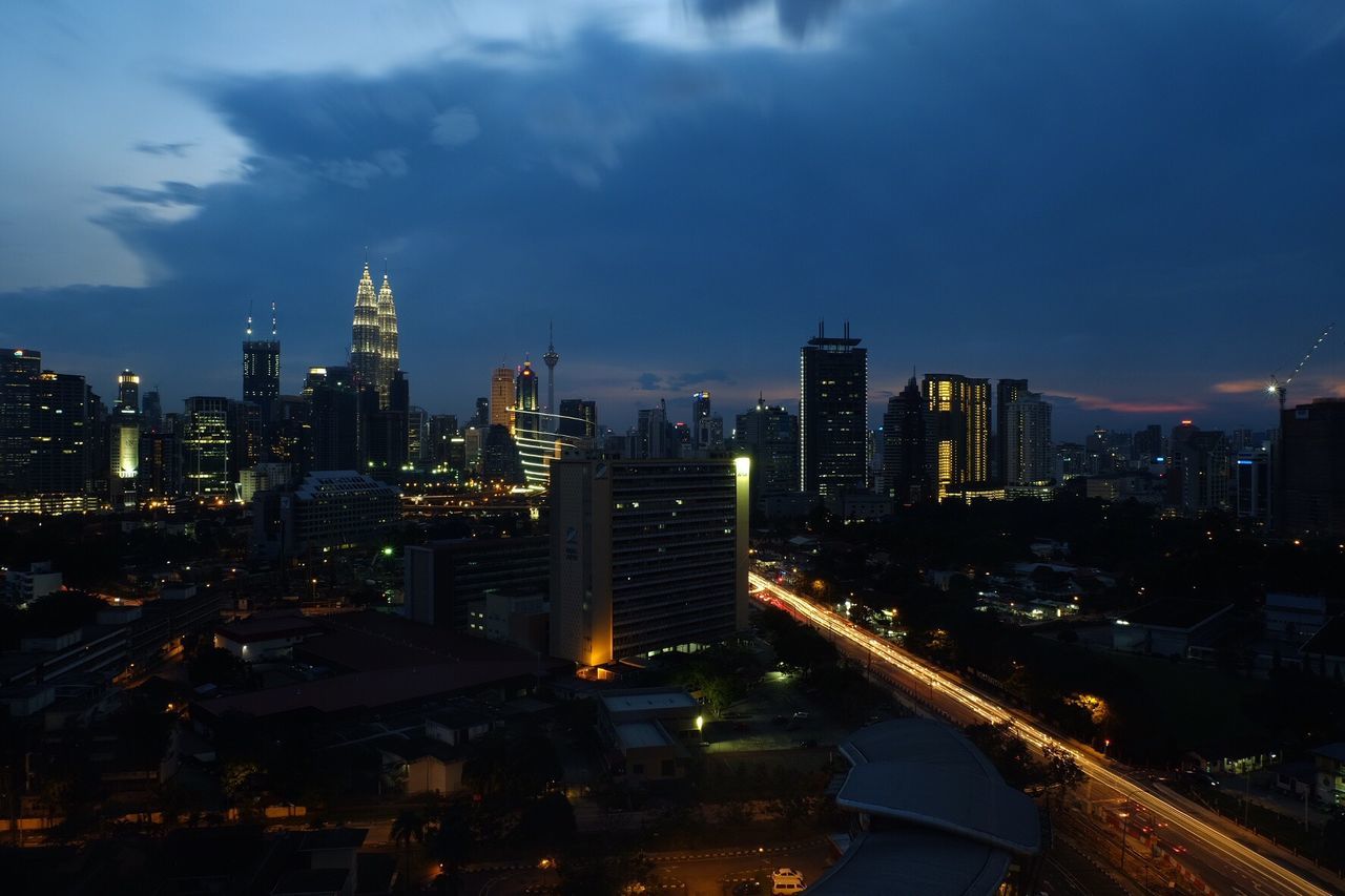 Aerial view of city lit up at night