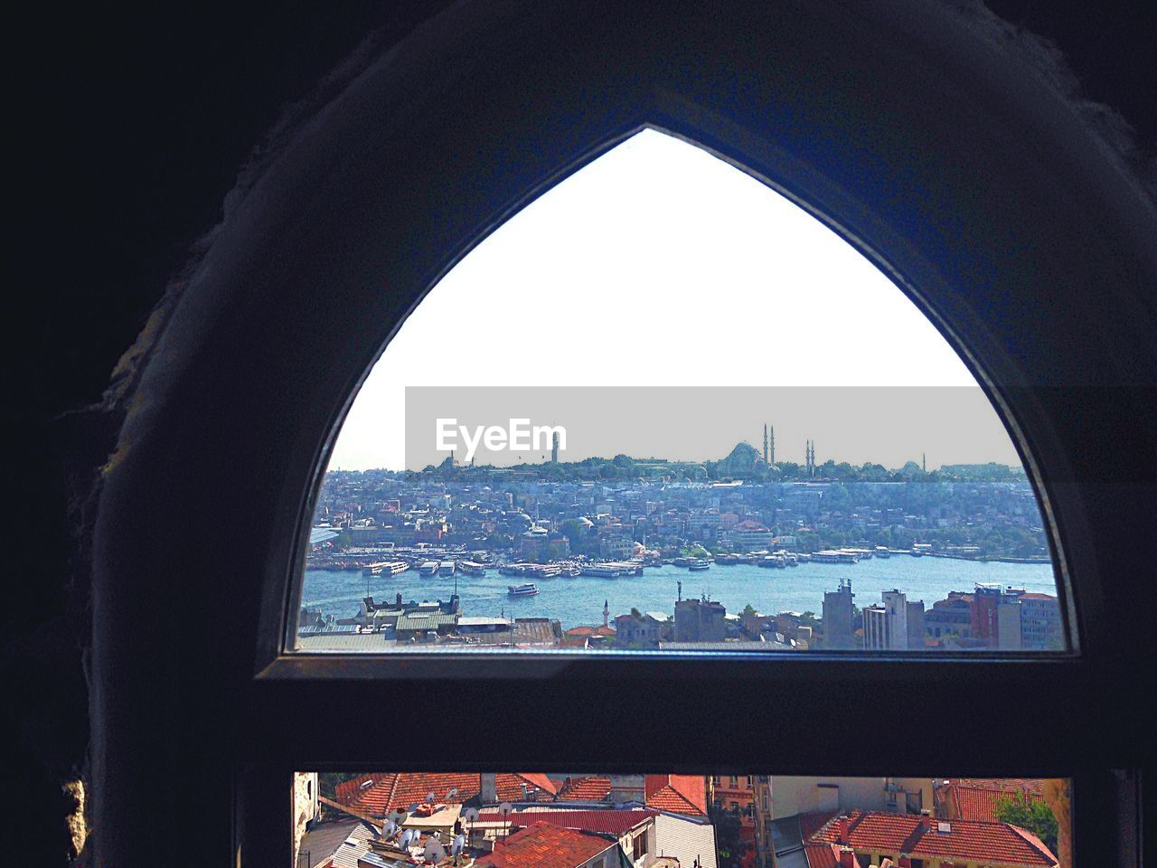 Cityscape seen through window of galata tower