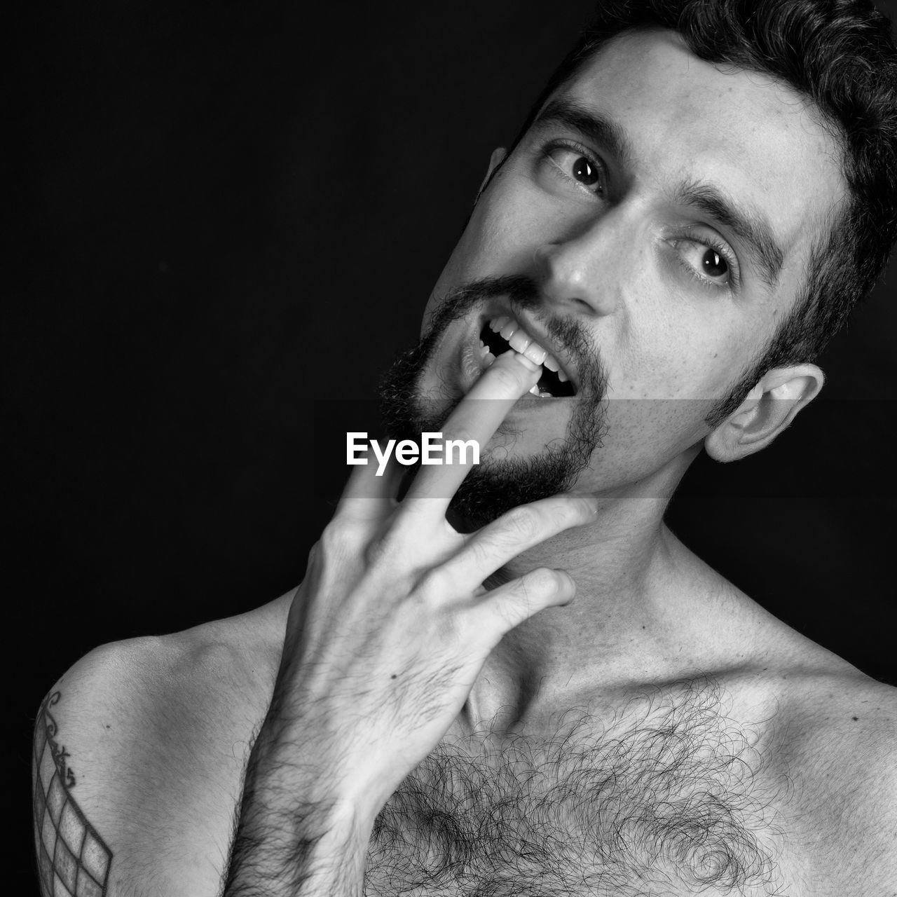 PORTRAIT OF YOUNG MAN SMOKING