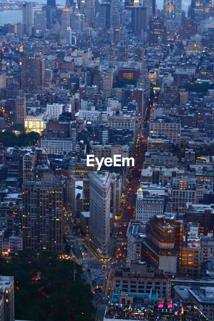 View of buildings in city at dusk