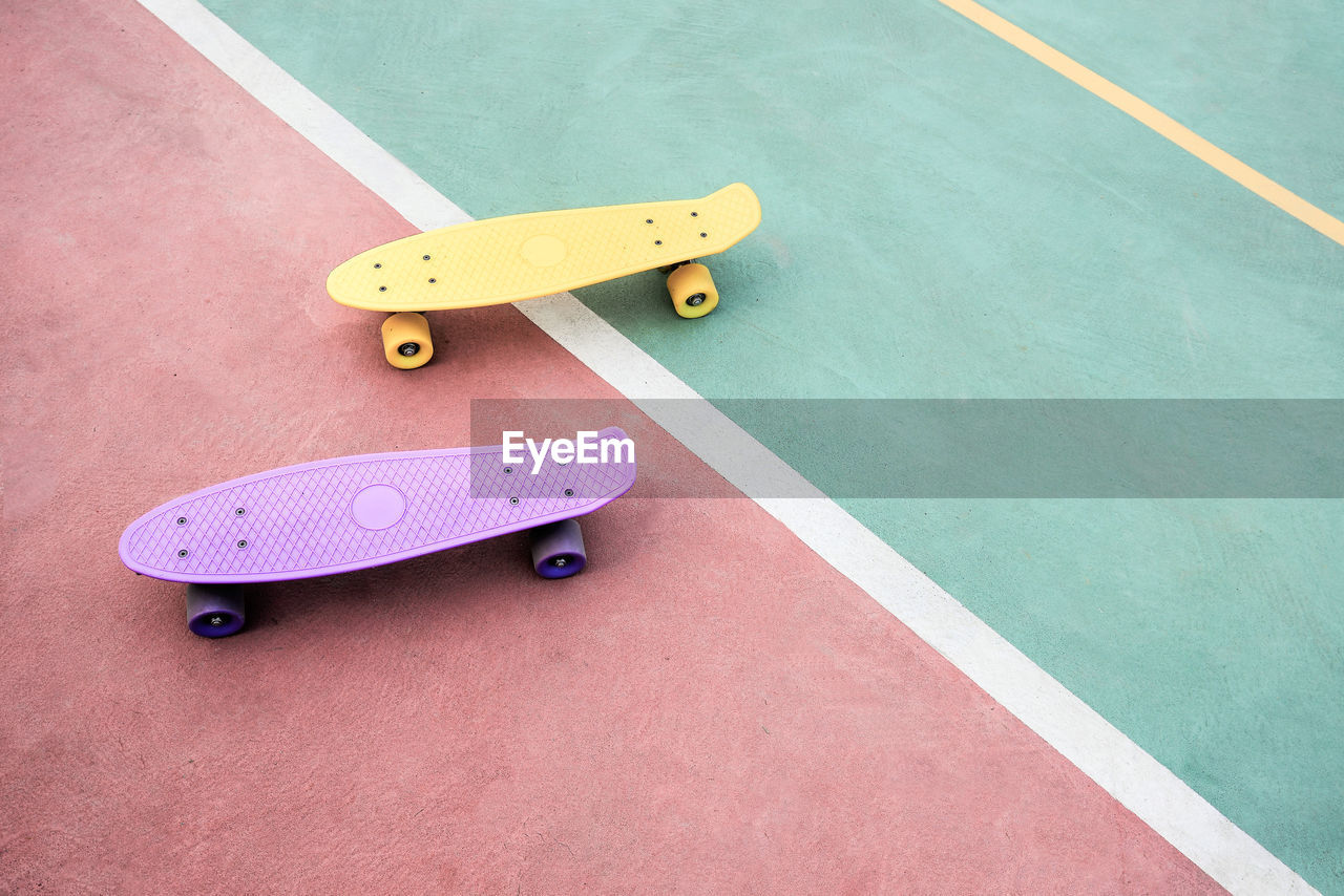 High angle view of skateboards on footpath