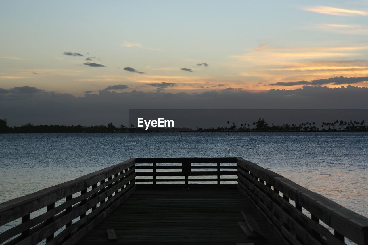 PIER ON SEA AT SUNSET