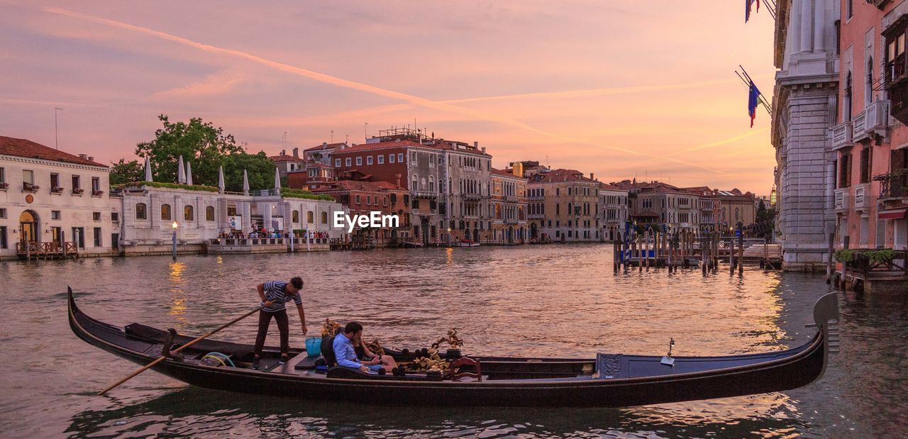 PEOPLE ON BOAT AT SUNSET