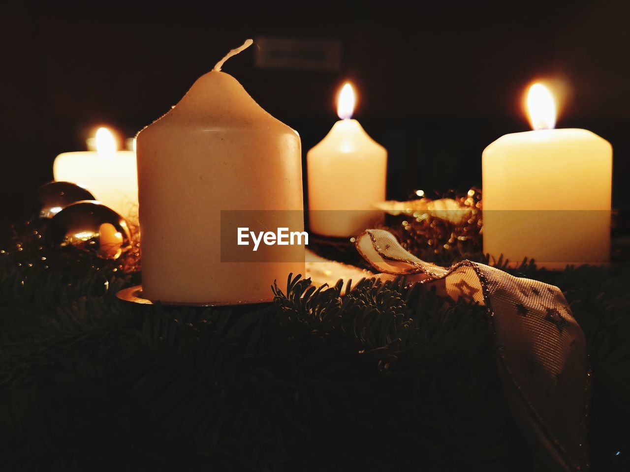 Close-up of illuminated candles during christmas