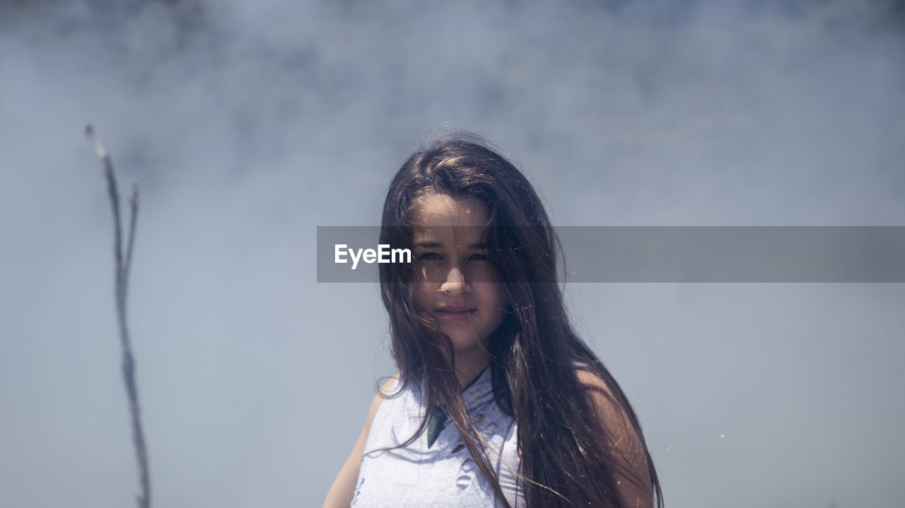 Portrait of girl against smoke