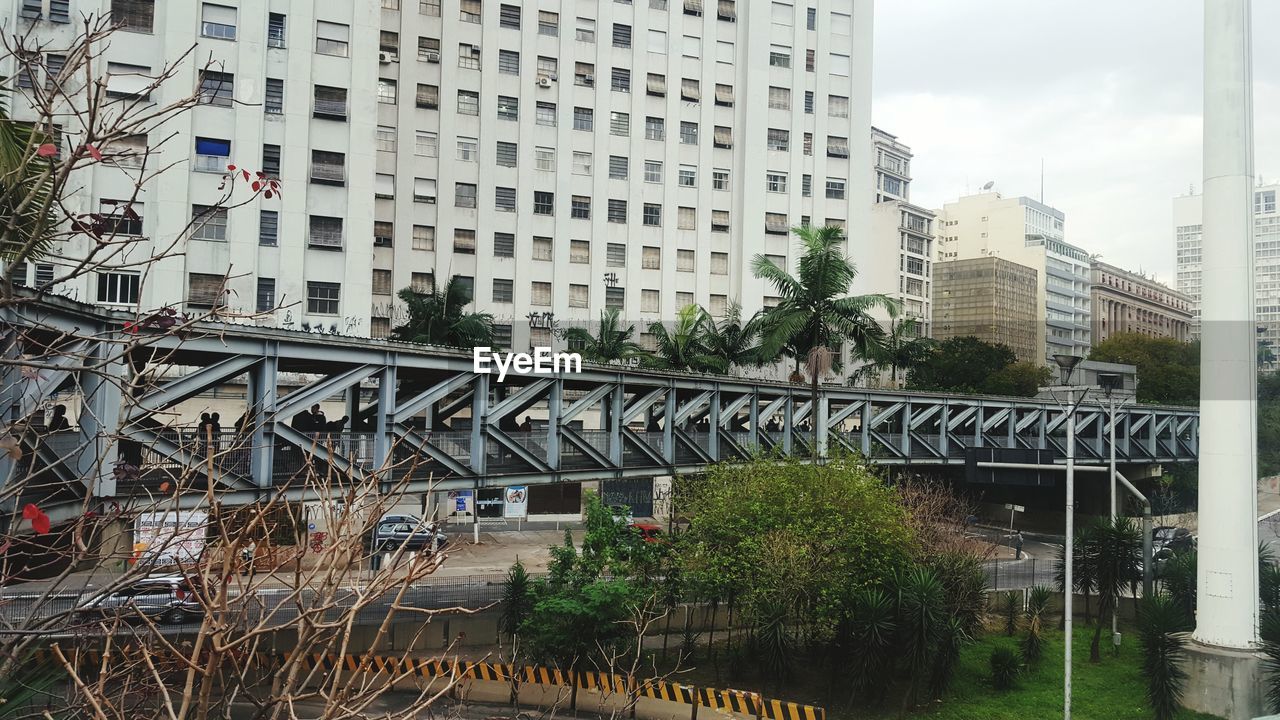Bridge against buildings in city