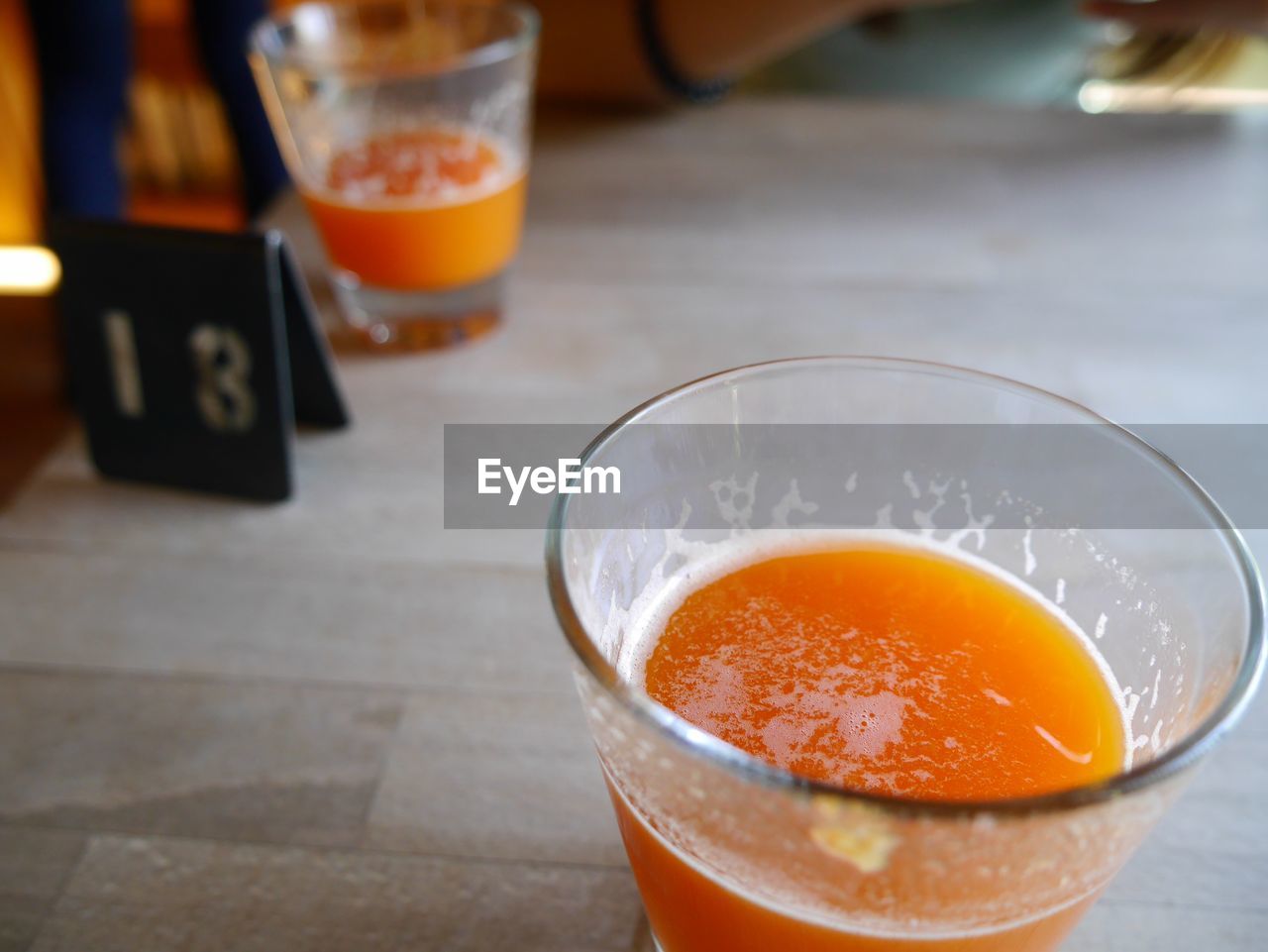 Close-up of orange juice on table