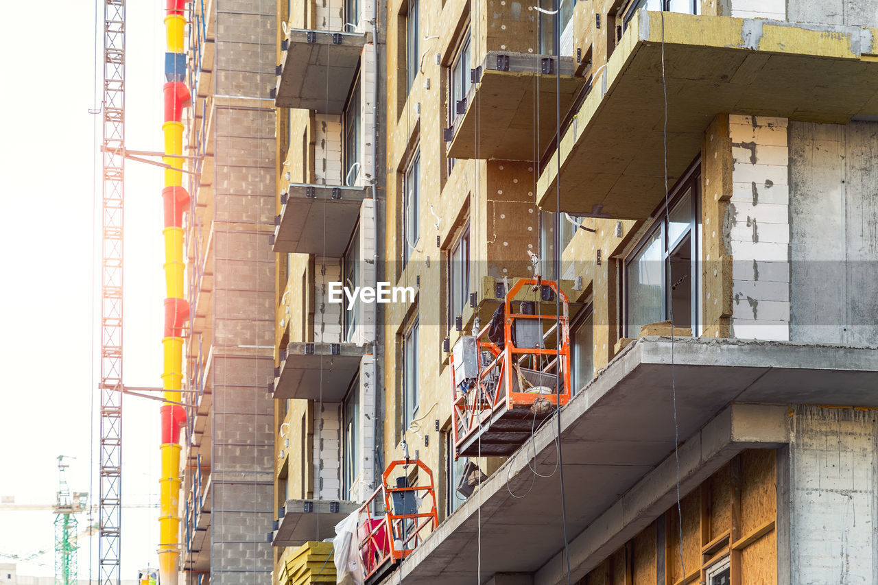 LOW ANGLE VIEW OF CONSTRUCTION BUILDING