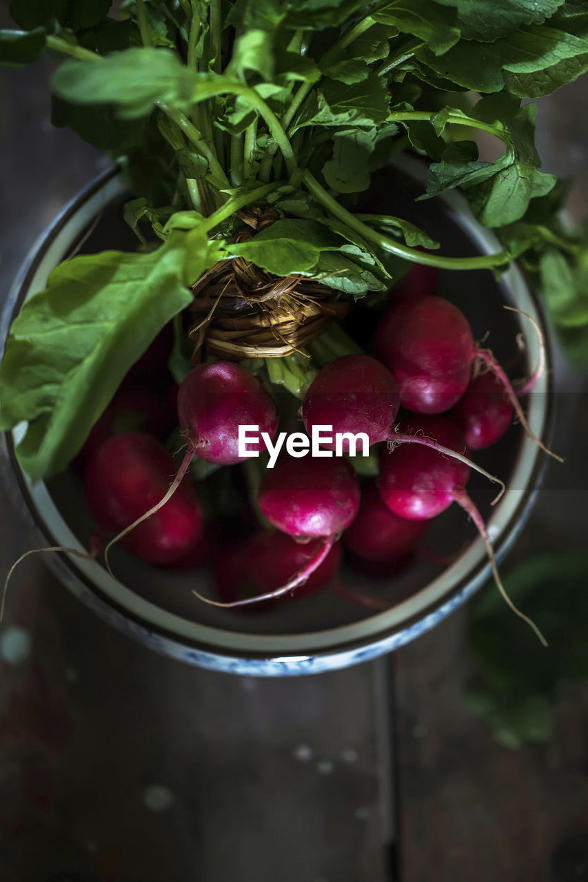 There is a bunch of delicious fresh radishes on the table