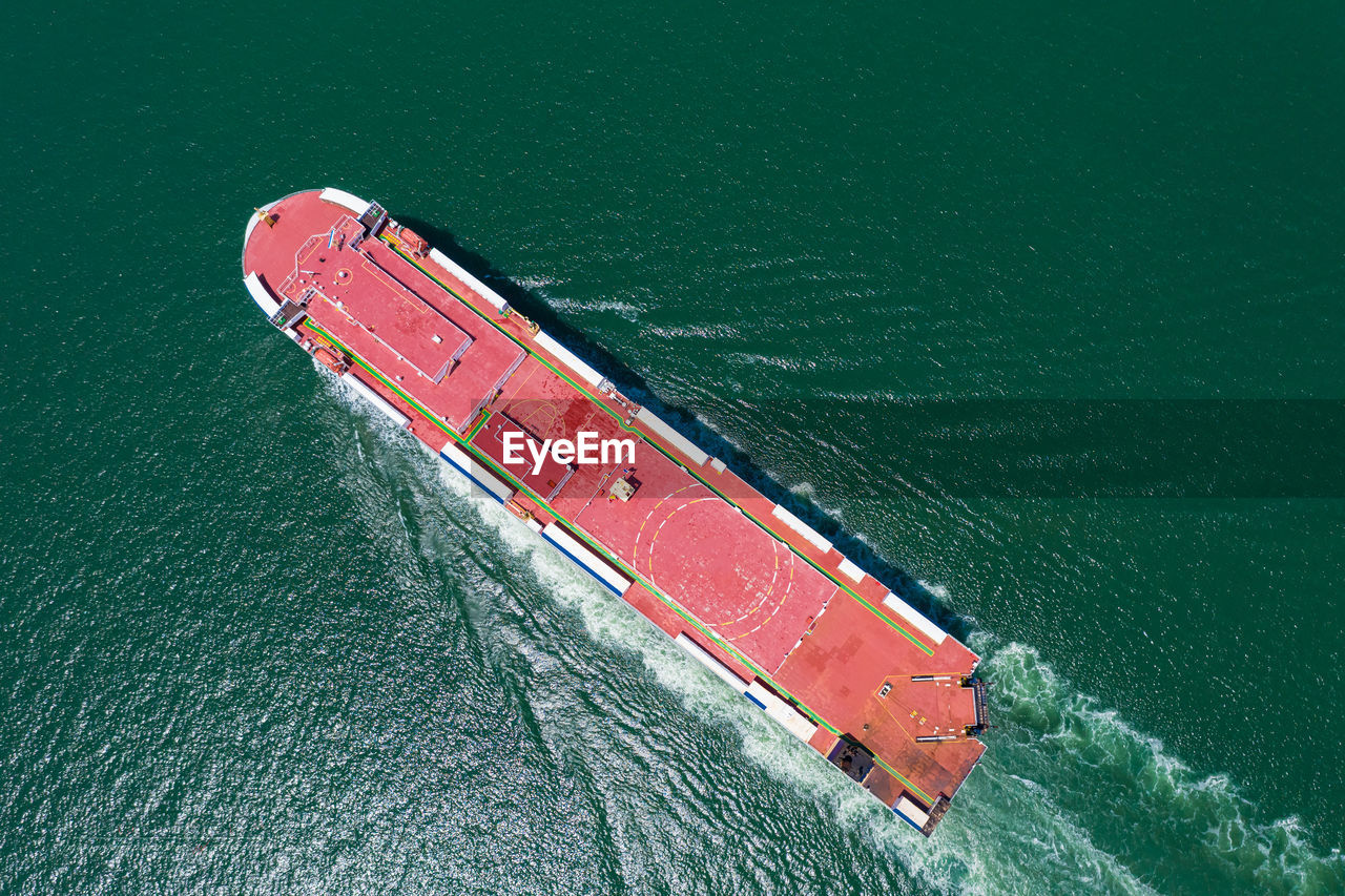 Aerial view of the huge ro-ro ship loading new cars. automotive container carriers 