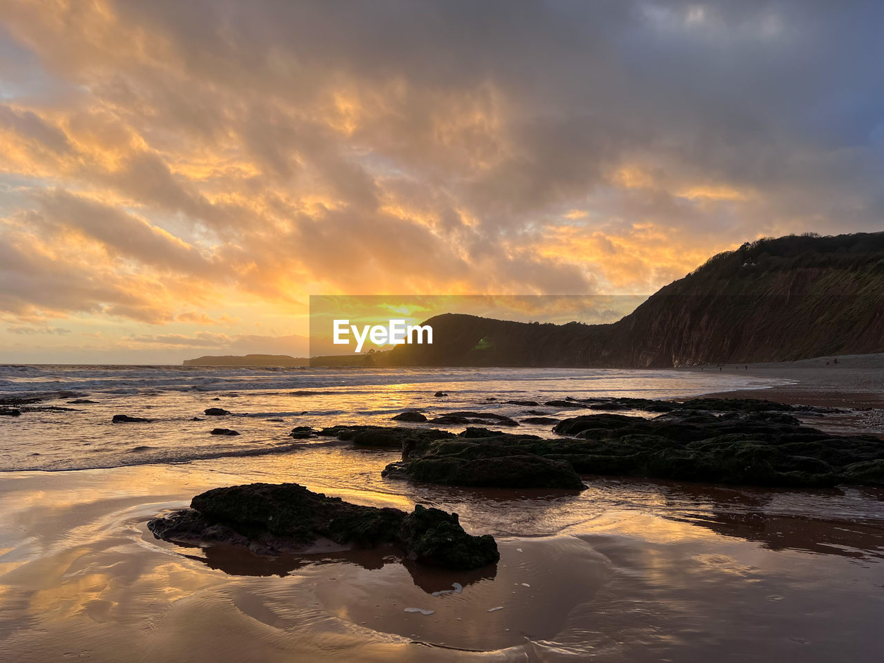 water, sea, sky, land, sunset, beach, coast, ocean, scenics - nature, beauty in nature, cloud, shore, wave, nature, horizon, environment, body of water, dawn, landscape, wind wave, sand, travel destinations, dramatic sky, seascape, reflection, rock, tranquility, evening, travel, bay, coastline, mountain, outdoors, sun, no people, tranquil scene, sunlight, motion, tourism