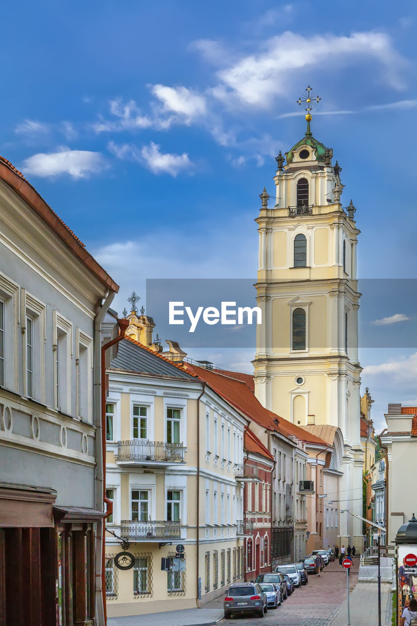 Street with bell tower of st. john church in baroque style, vilnius, lithuania
