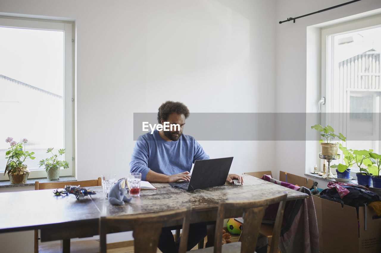 Man working on laptop from home