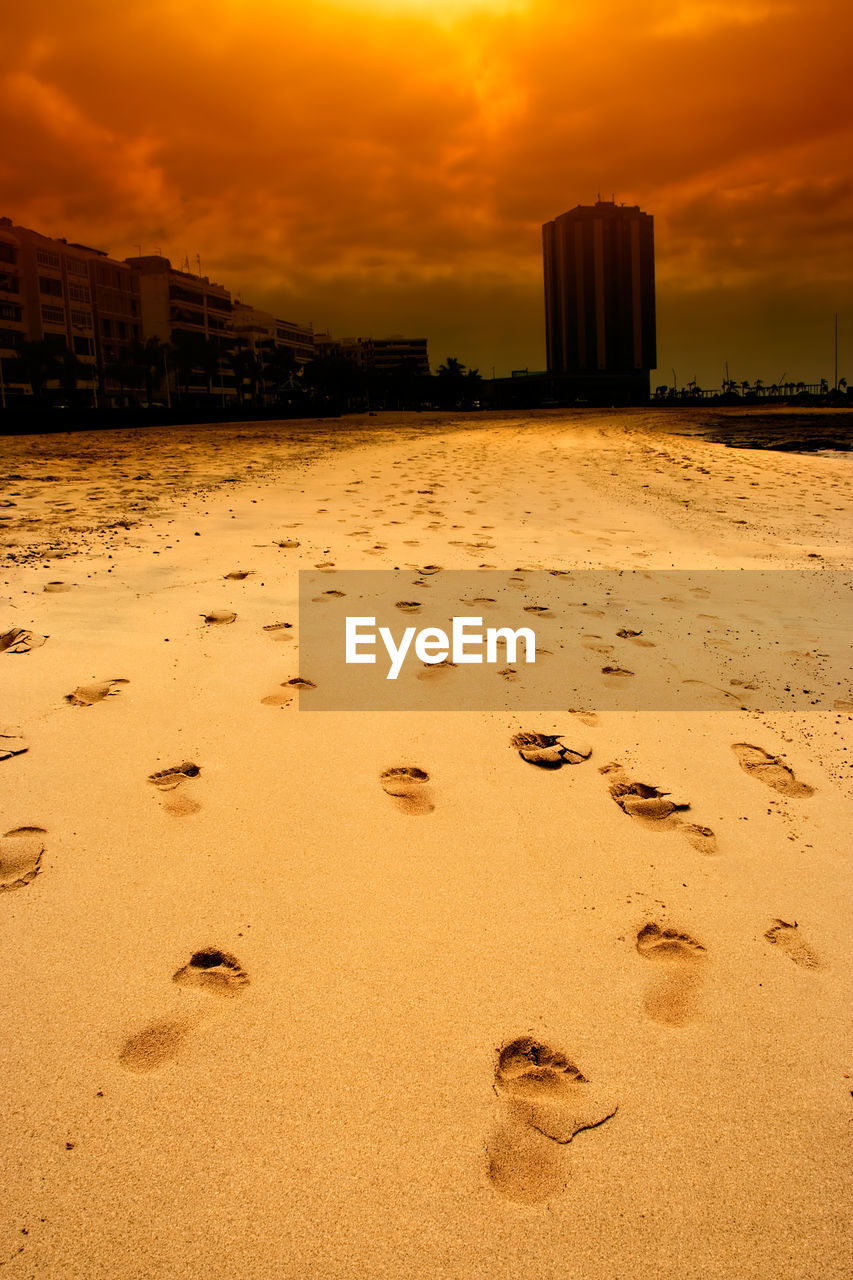 SCENIC VIEW OF BEACH DURING SUNSET