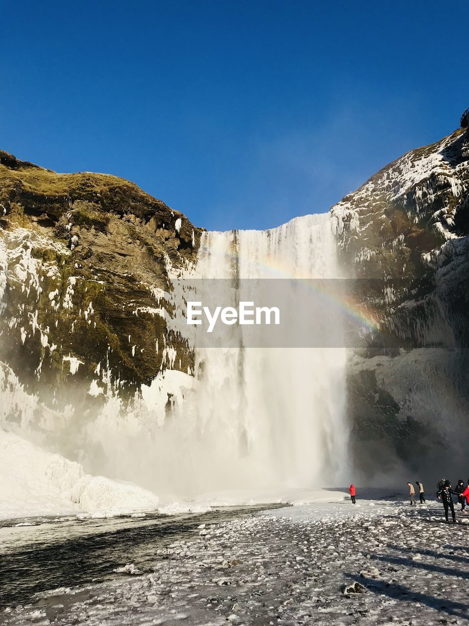 Panoramic view of waterfall against sky