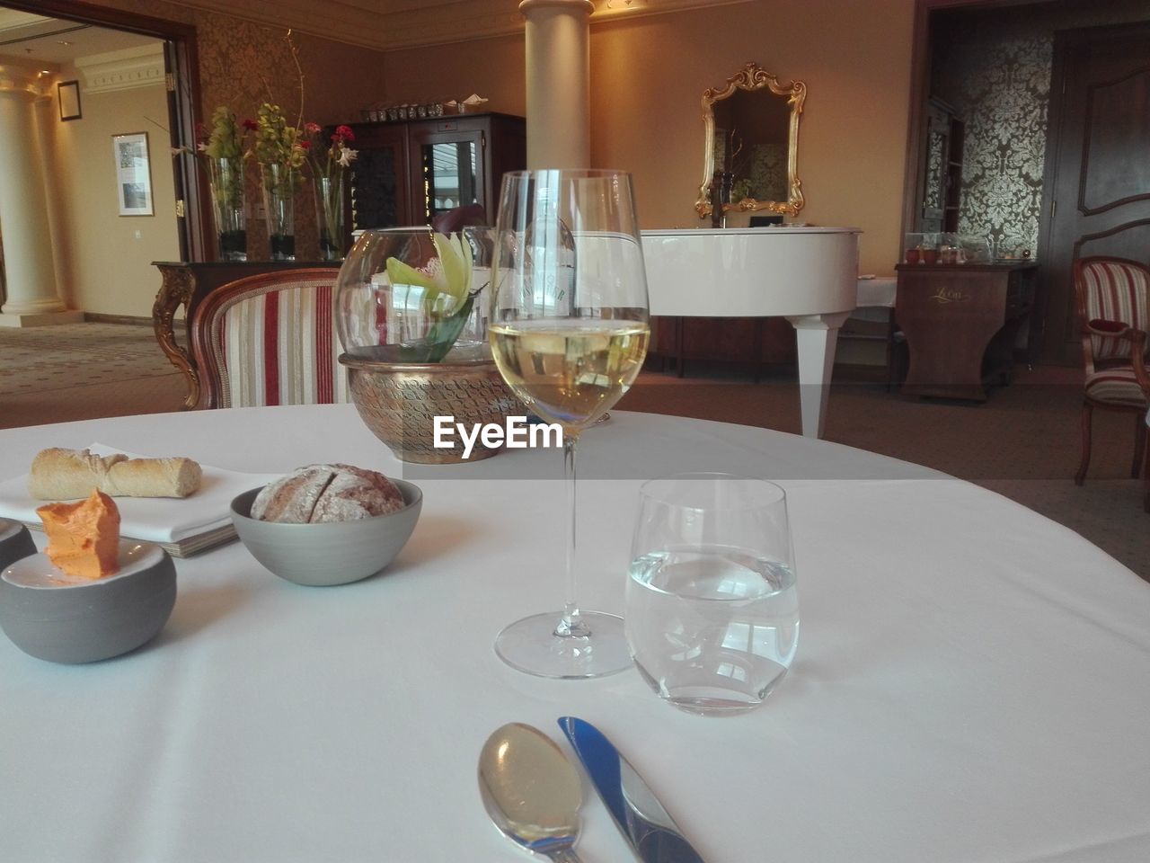 CLOSE-UP OF WINE ON TABLE AT HOME