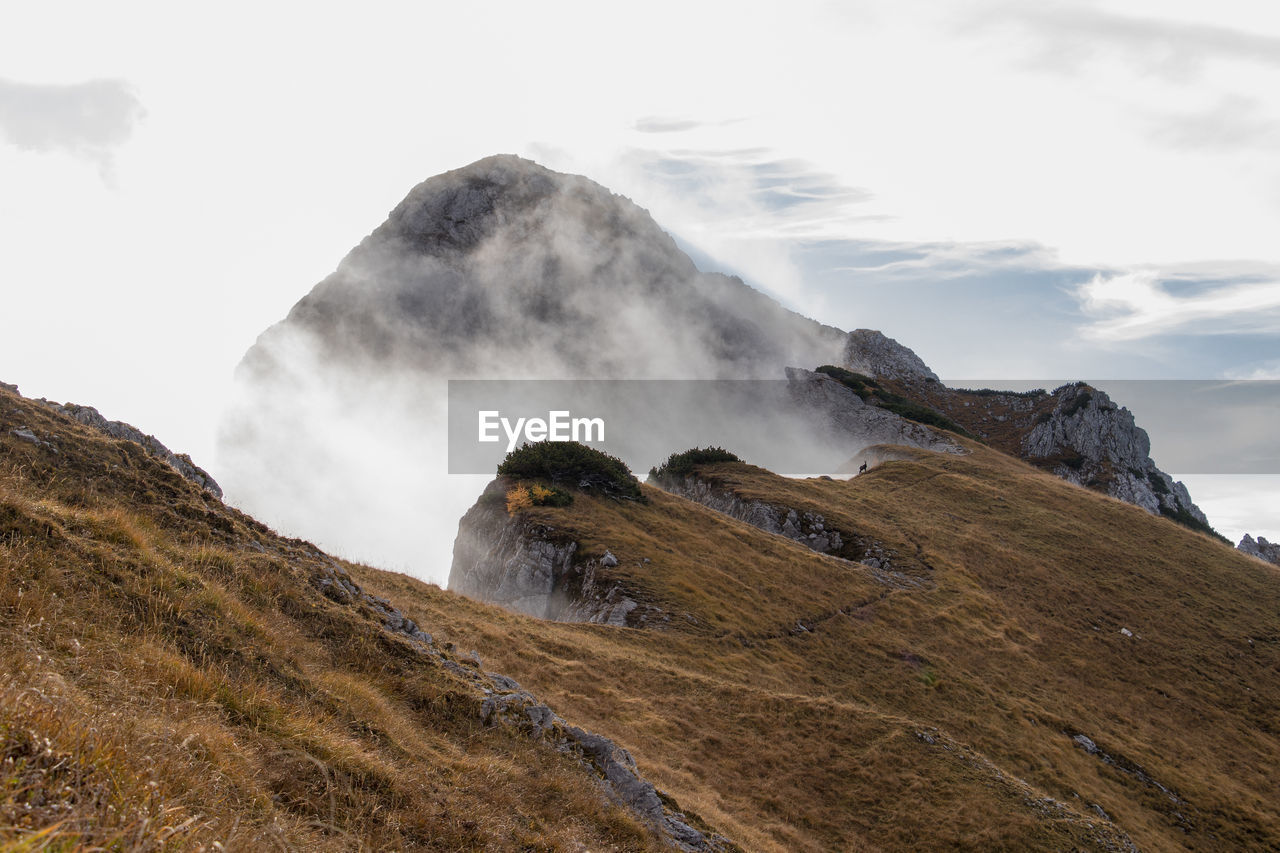 SCENIC VIEW OF MOUNTAINS AGAINST SKY DURING WINTER