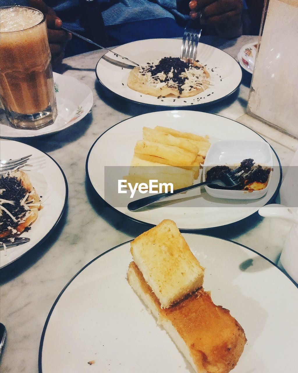 High angle view of snacks and coffee on table