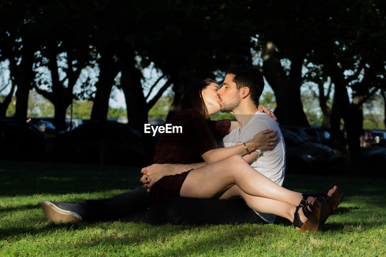 WOMAN SITTING IN PARK