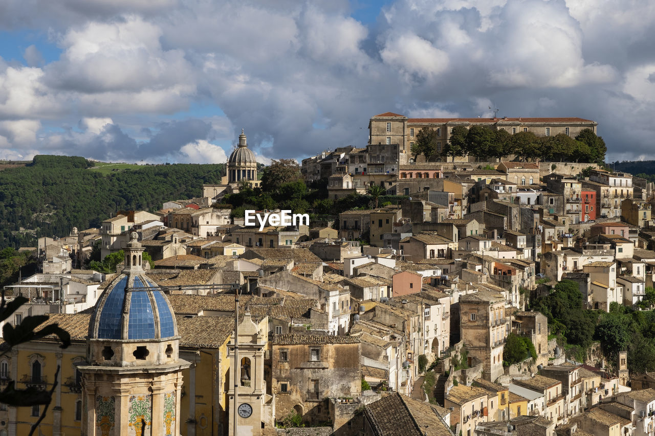 Aerial view of townscape against sky