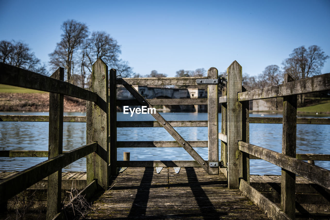 Scenic view of calm lake against blue sky