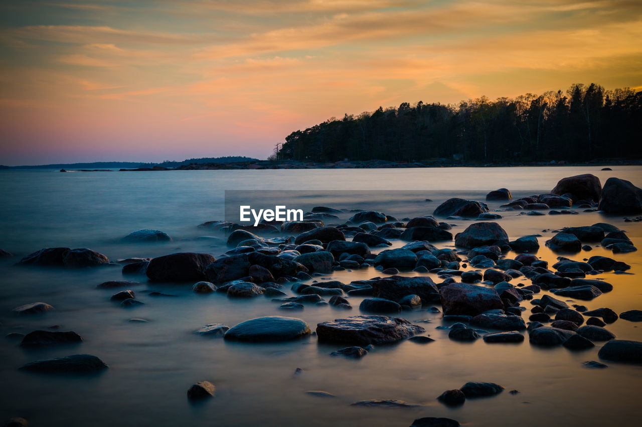 Scenic view of sea against sky during sunset