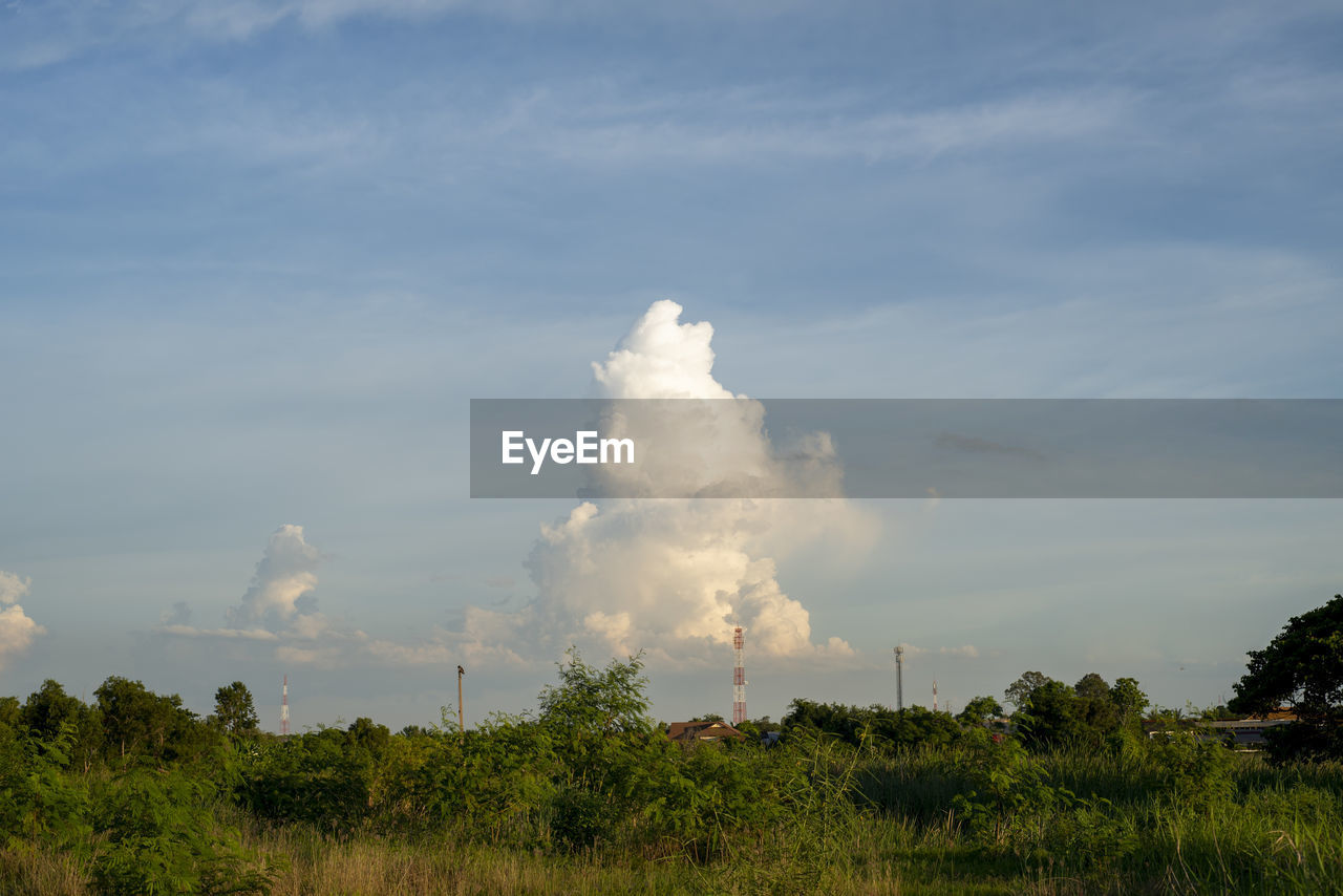 SMOKE STACKS AGAINST SKY