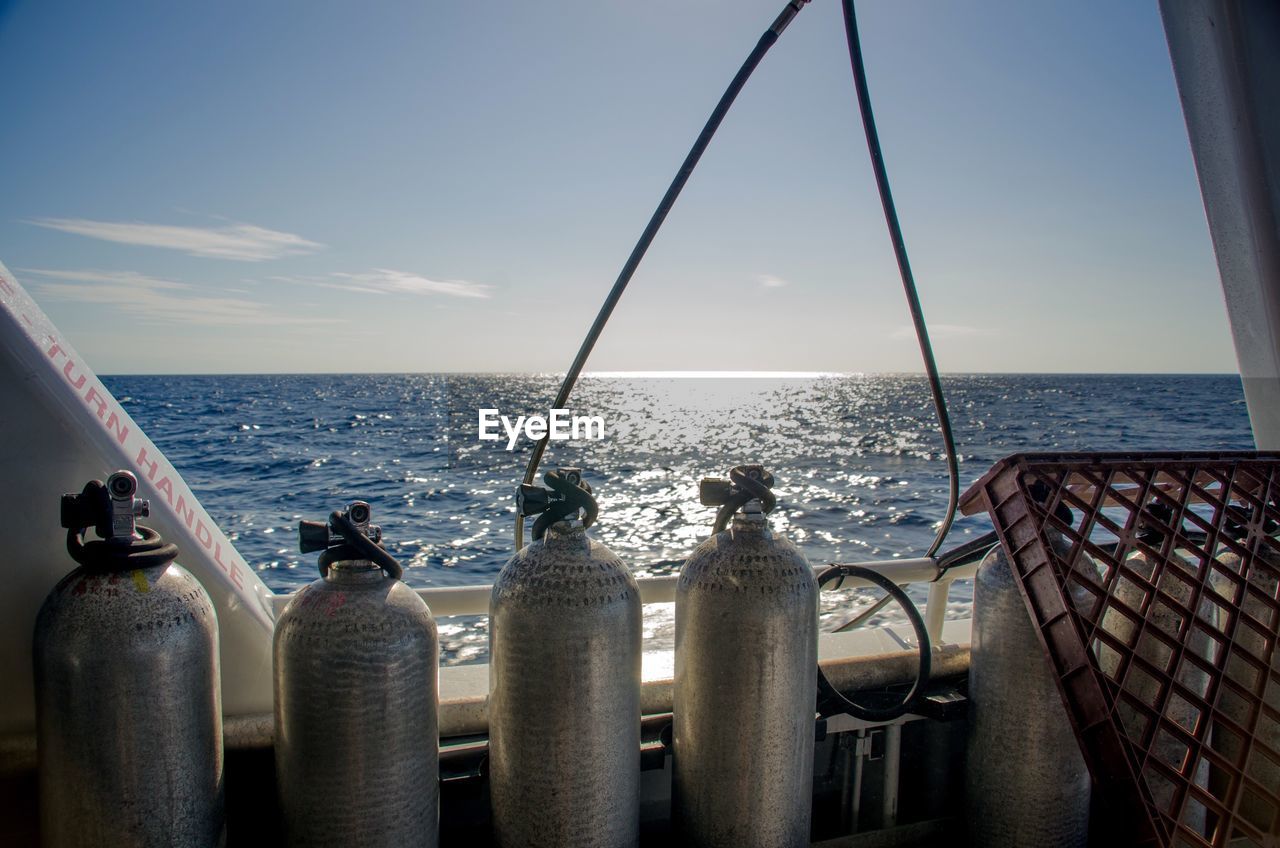 Cylinders on boat in sea