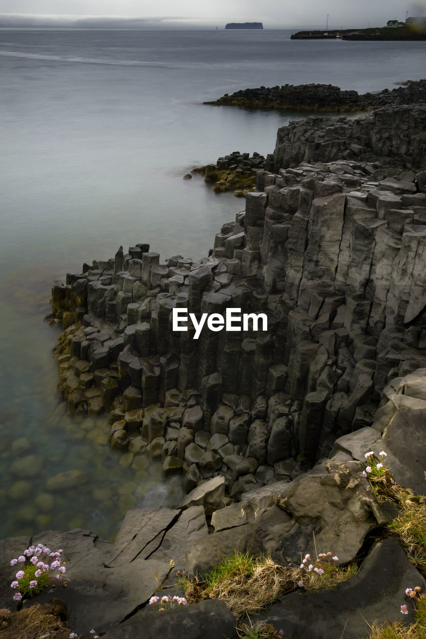 Scenic view of basalt columns on beach