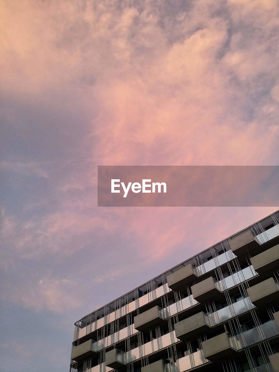 Low angle view of building against sky during sunset