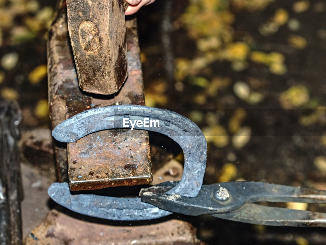 Blacksmith working on anvil, making a horseshoe. traditional blacksmith tool for craft in workshop