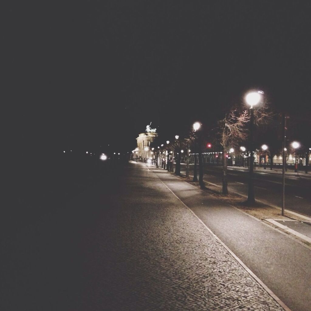 Illuminated street at night