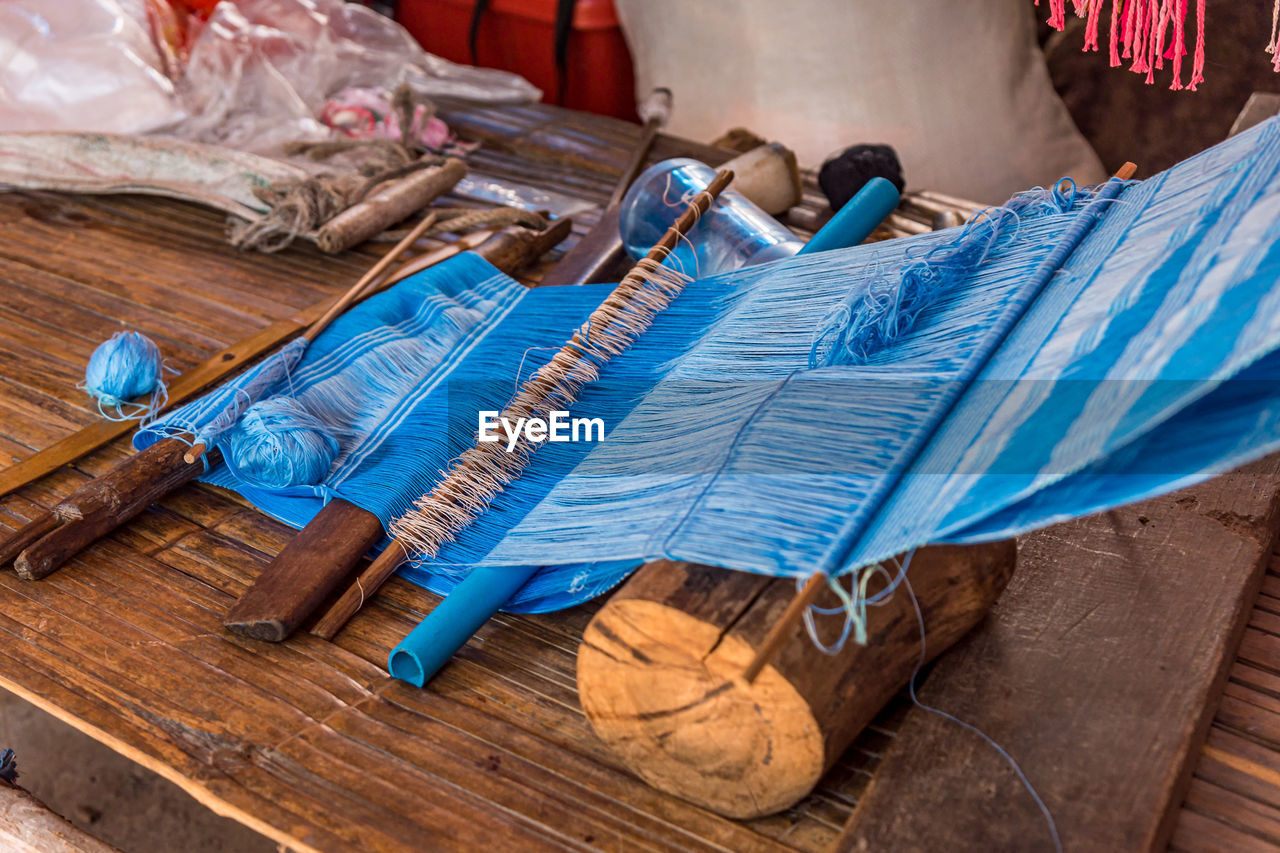 High angle view of loom equipment on table