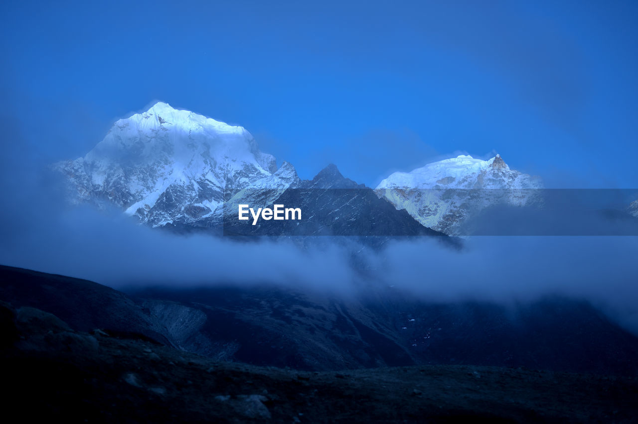 Scenic view of snow covered mountains