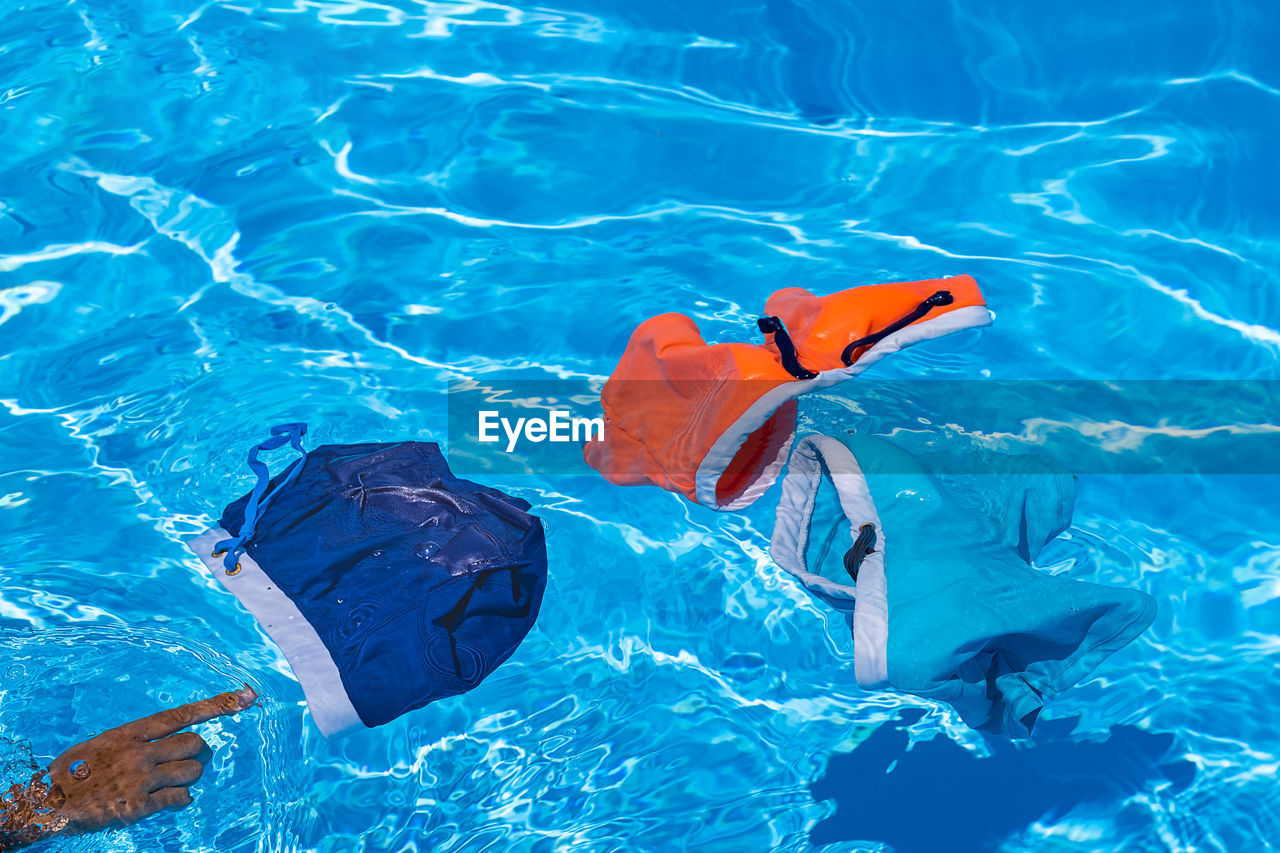 High angle view of swimwear in swimming pool 