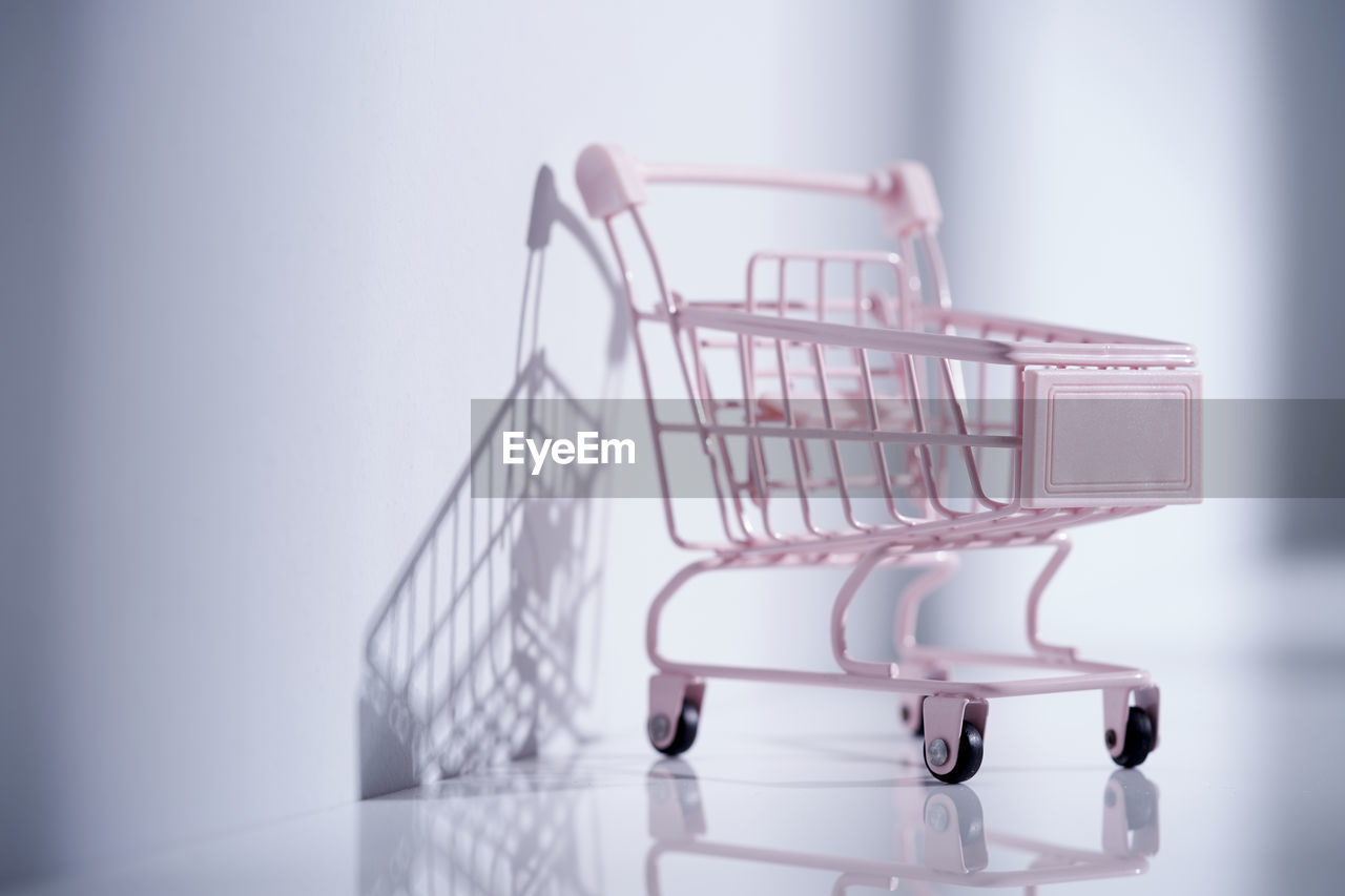 Empty toy shopping cart on table top