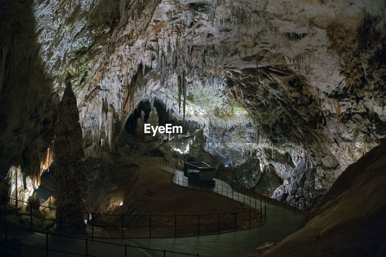 PANORAMIC VIEW OF ILLUMINATED CAVE AND ROCK FORMATION