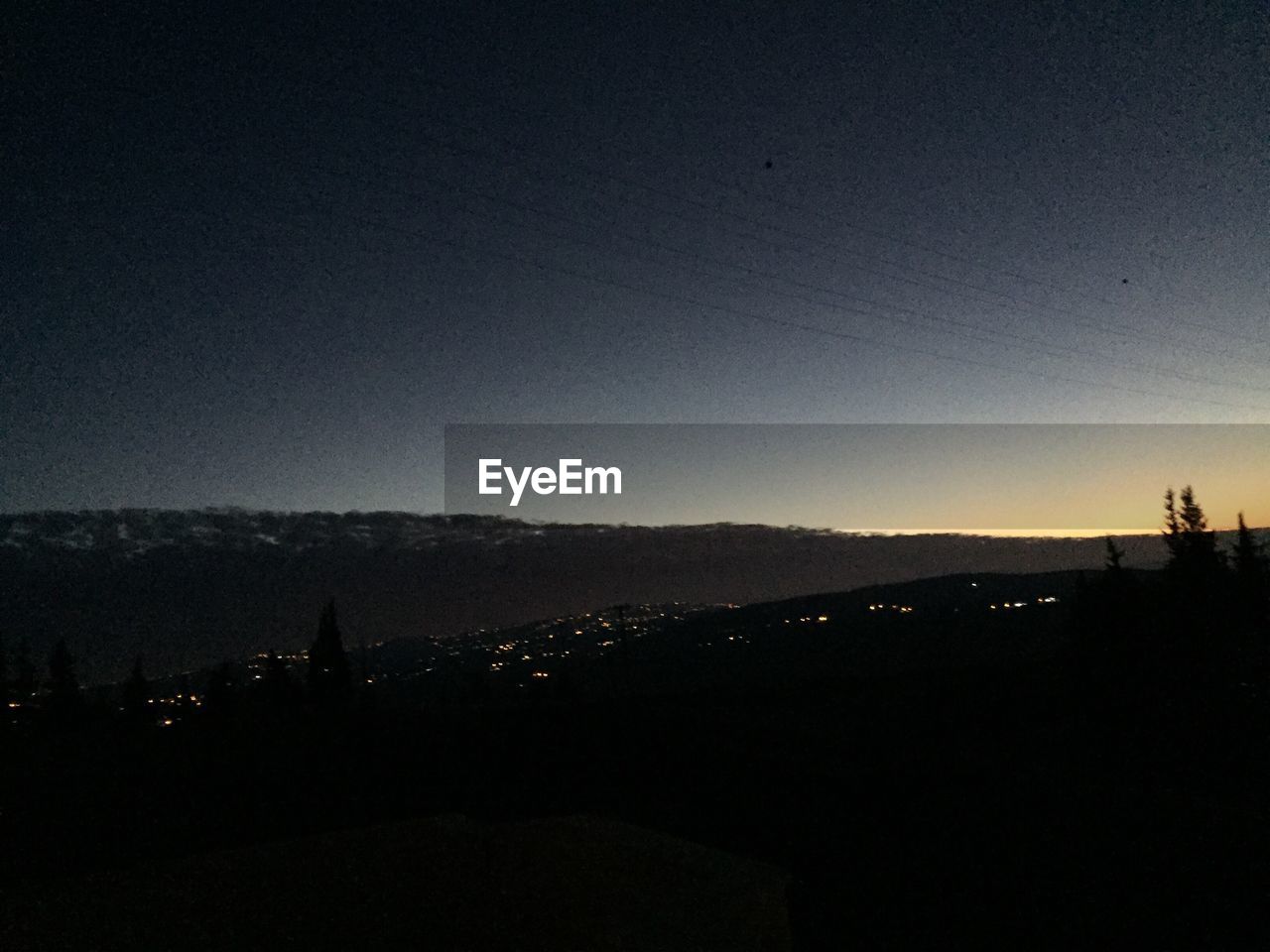 SCENIC VIEW OF DRAMATIC SKY OVER SILHOUETTE LANDSCAPE